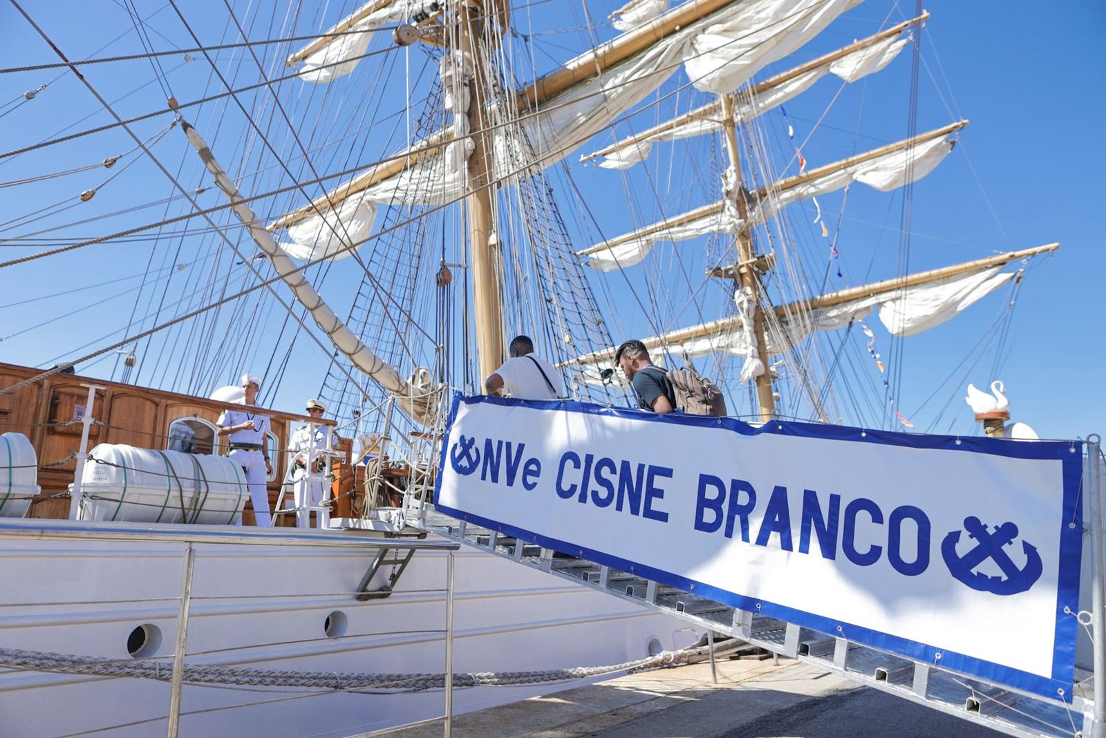 Visitors walking up the Cisne Branco gangway
