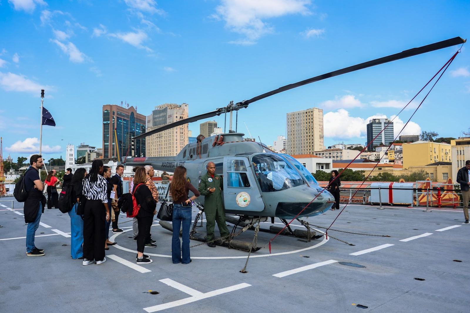 Visitors around a helicopter on the flight deck