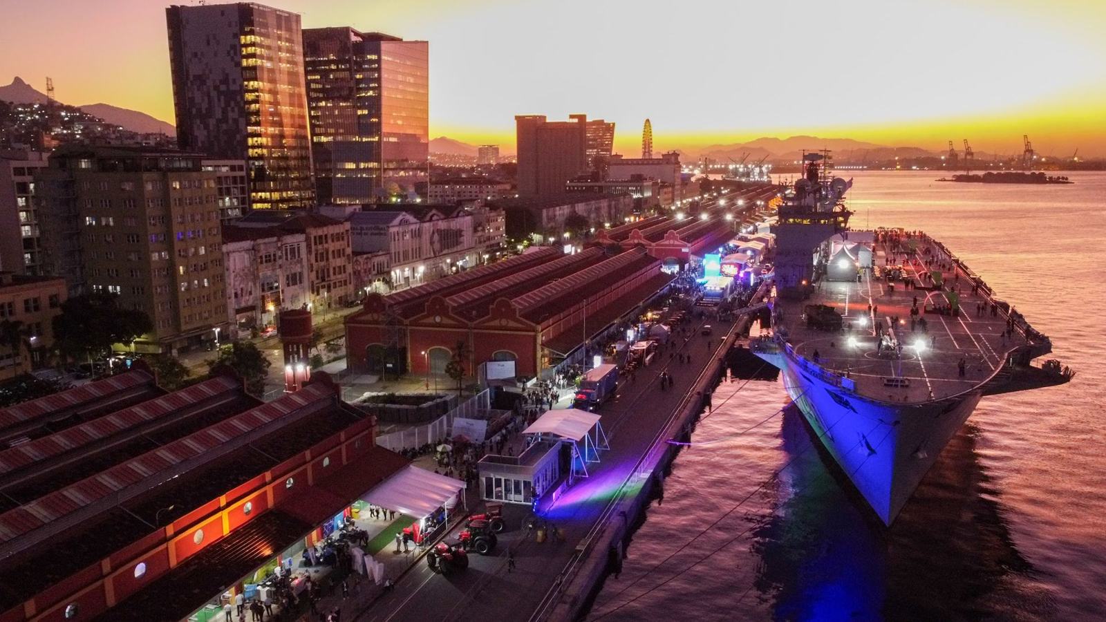 Aerial view of Pier Mauá at sunset with NAM Atlântico docked during Rio Innovation Week