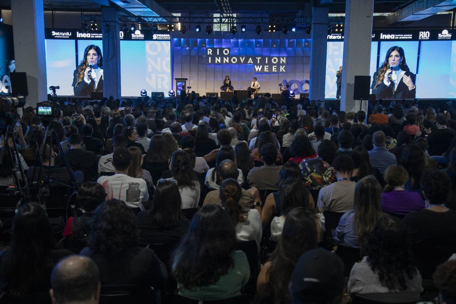 Packed plenary with large screens