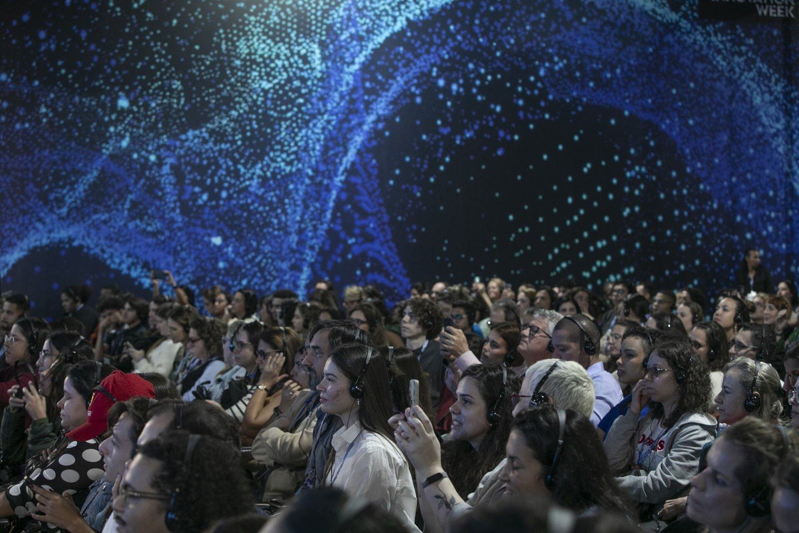 Packed audience under an LED dome at Rio Innovation Week